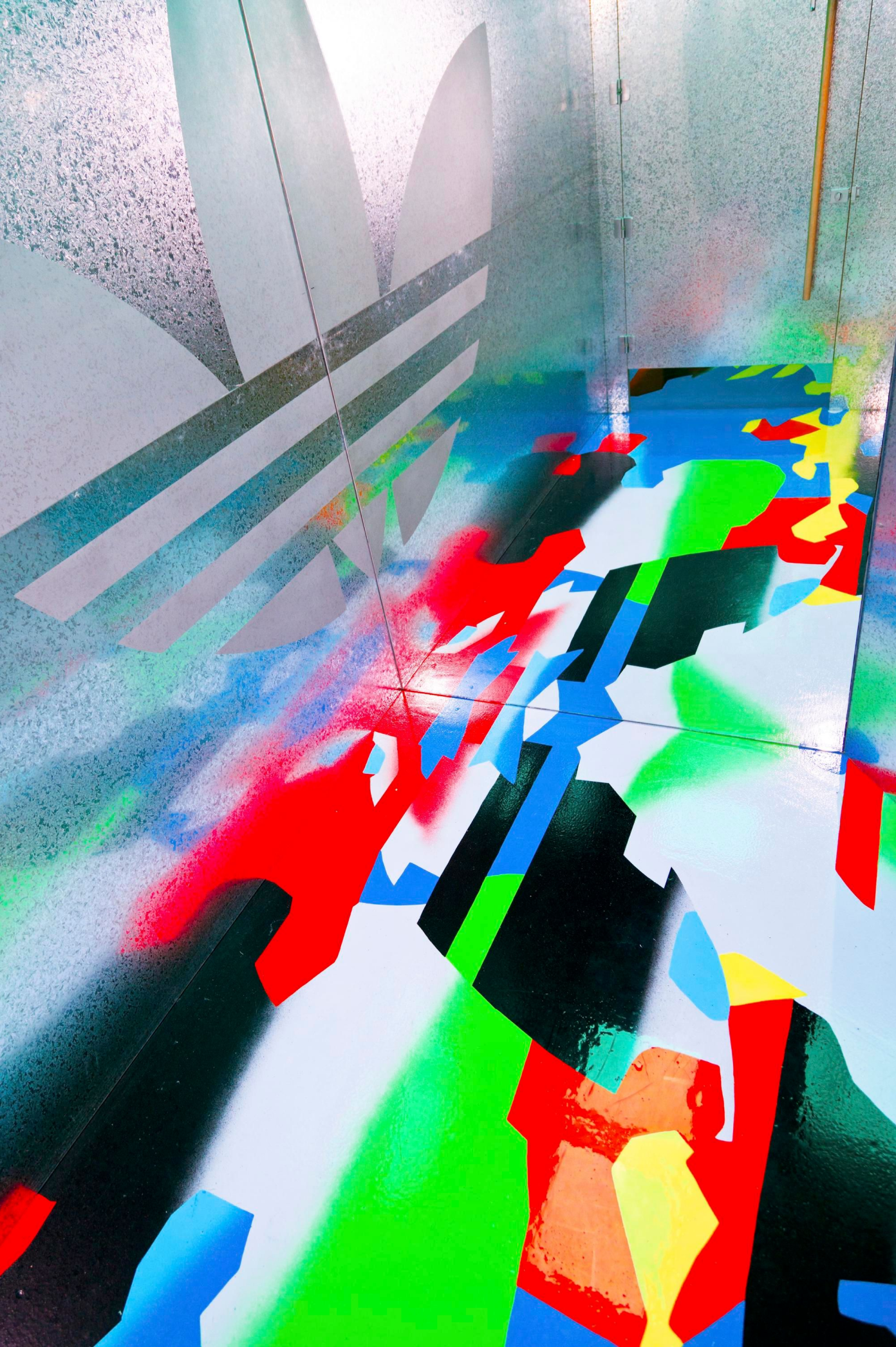 A colourfully painted floor artwork for Adidas