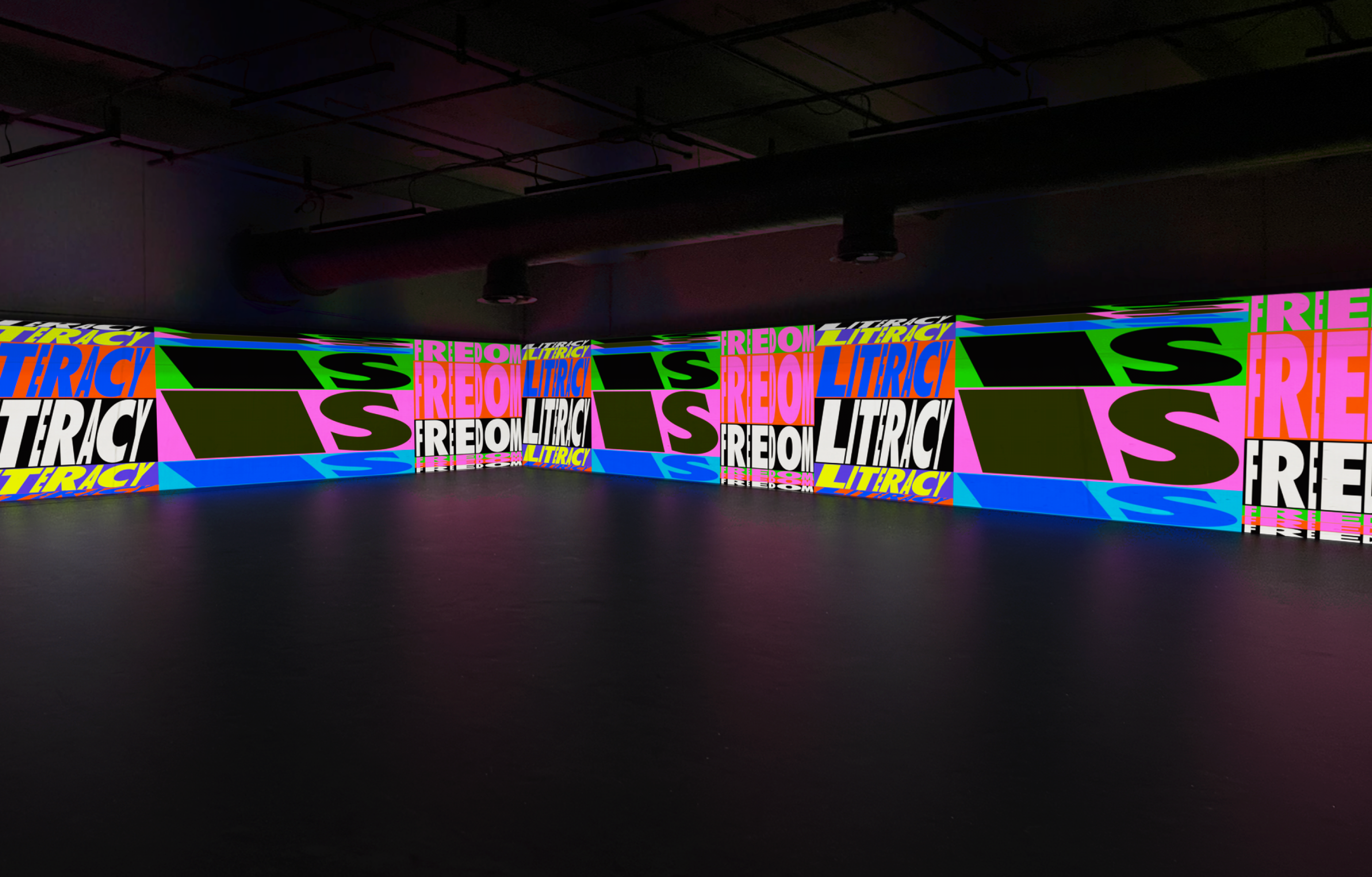 ALNF projection, three walls with colourful repeating text