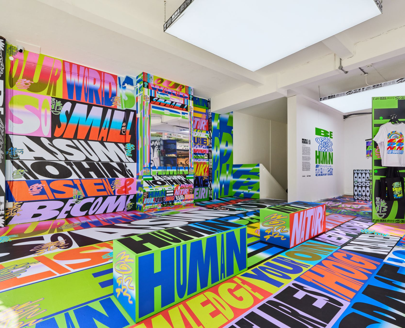 A room entirely covered with brightly coloured artwork by Kris Andrew Small