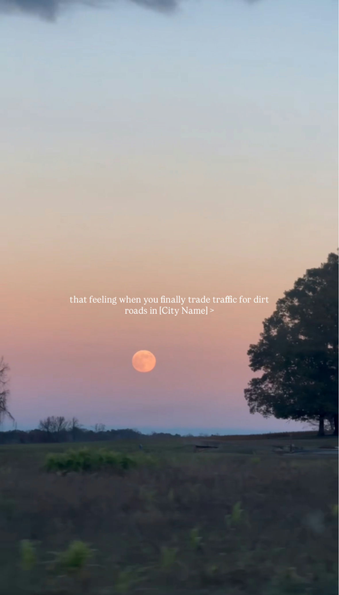  Full moon over a rural field at sunset with trees in silhouette; text about trading traffic for dirt roads in [City Name].