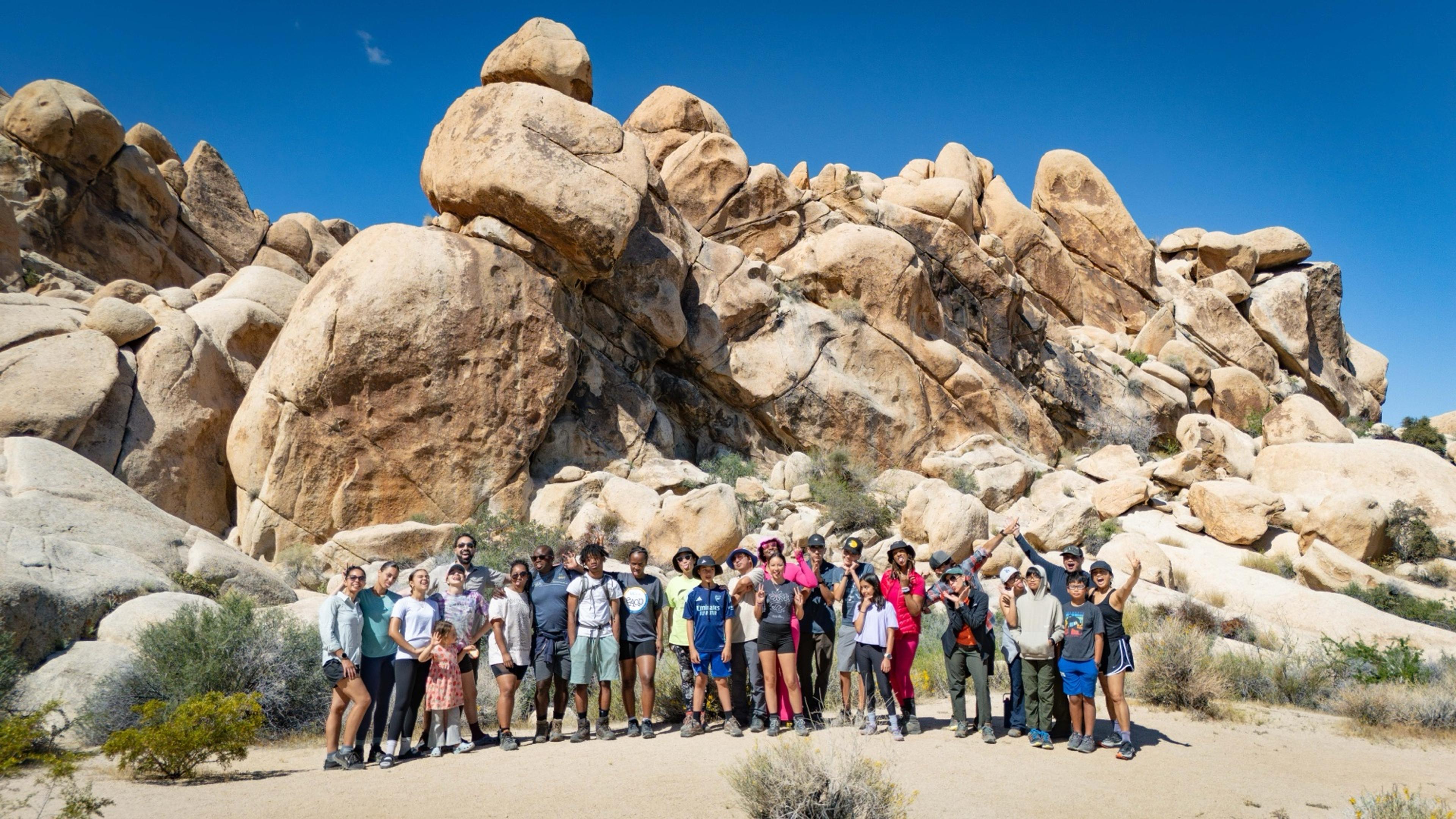 Outdoorithm Collective group of more than 30 people gathered at Hidden Valley in Joshua Tree National Park during spring break 2026