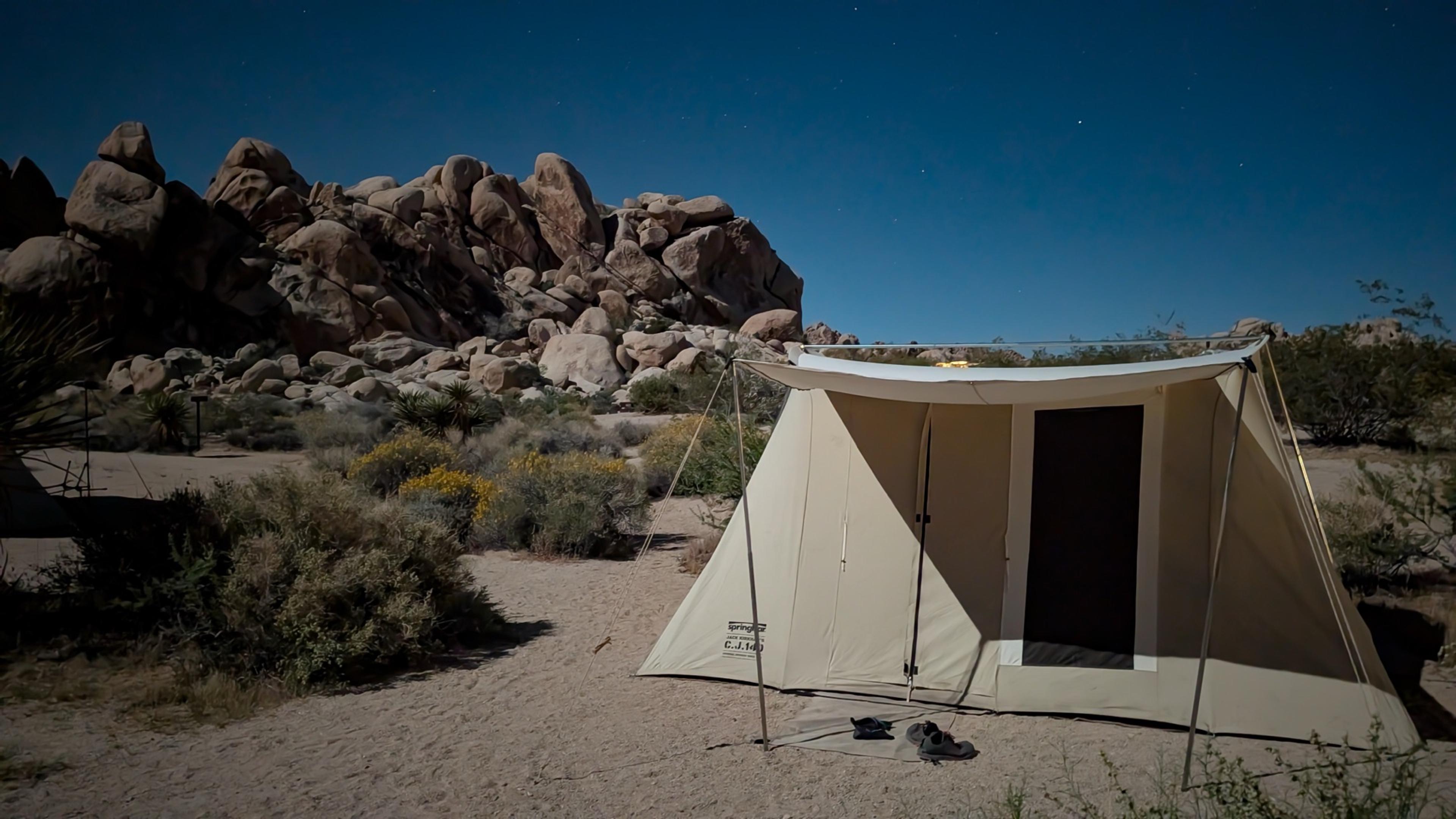 Springbar Classic Jack canvas tent pitched at Indian Cove Group Campground at night with stars visible above and granite boulders in the background