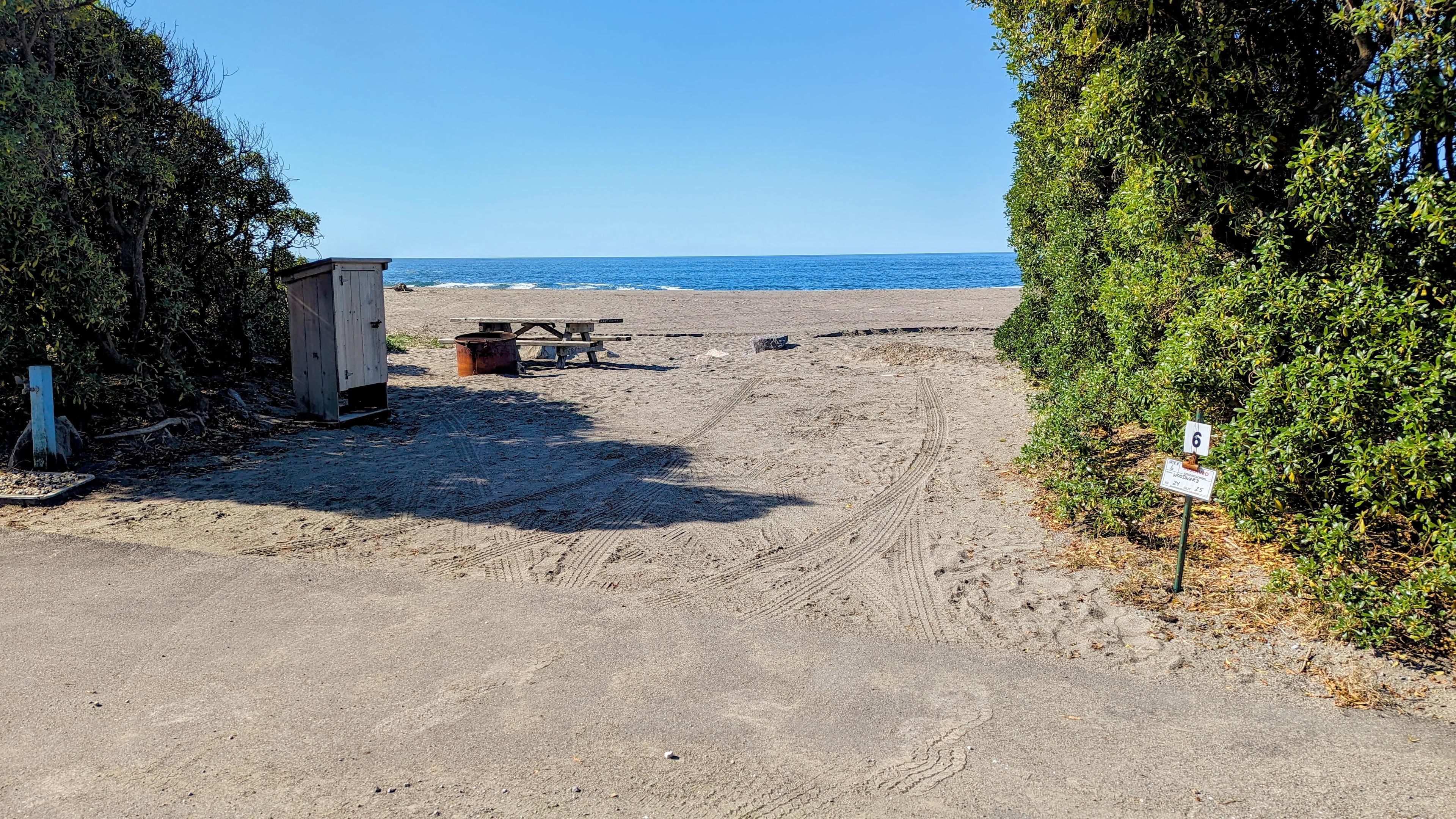Wright's Beach campsite number 6 opening onto the sand and the Pacific, brush buffering the sides Wright's Beach campsite number 6 opening onto the sand and the Pacific, brush buffering the sides