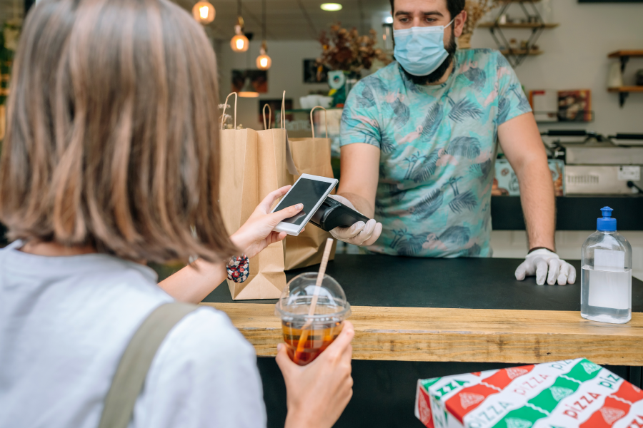 Customer using app to make a purchase in store.