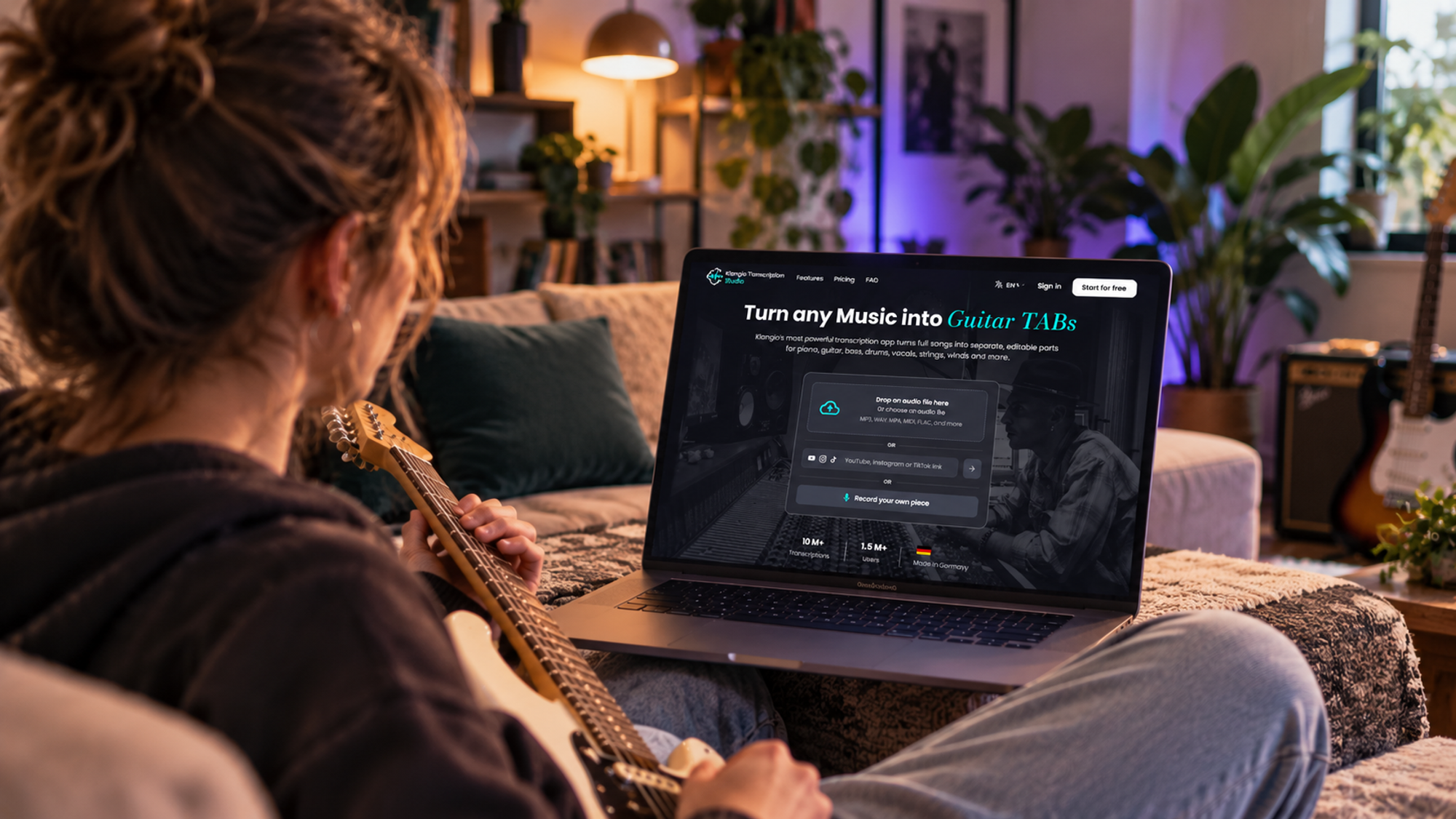 Musician creating guitar tabs automatically with Klangio Transcription Studio on a laptop