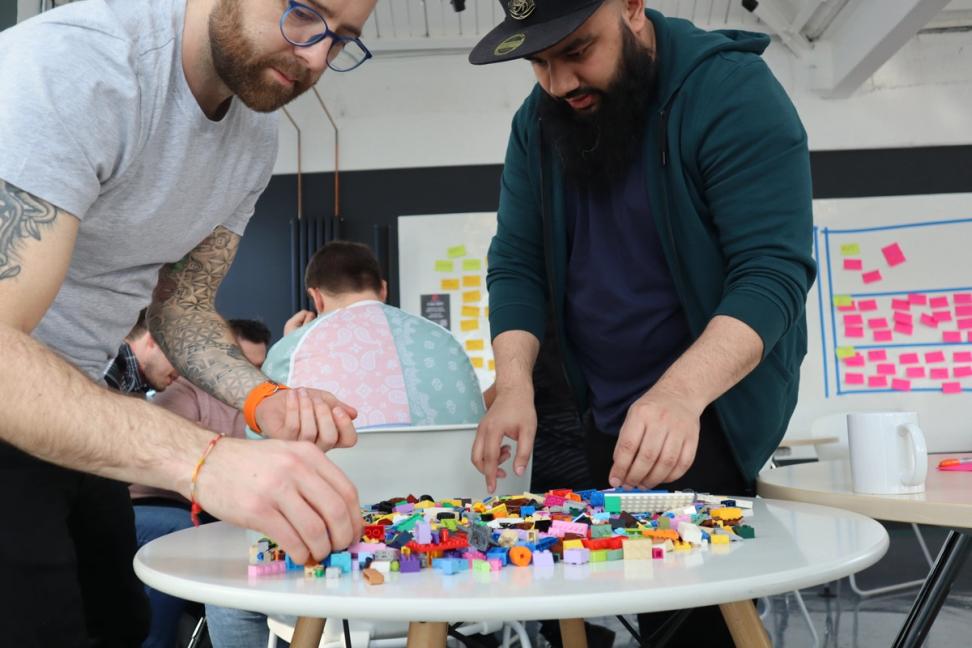 People learning while playing with Lego bricks