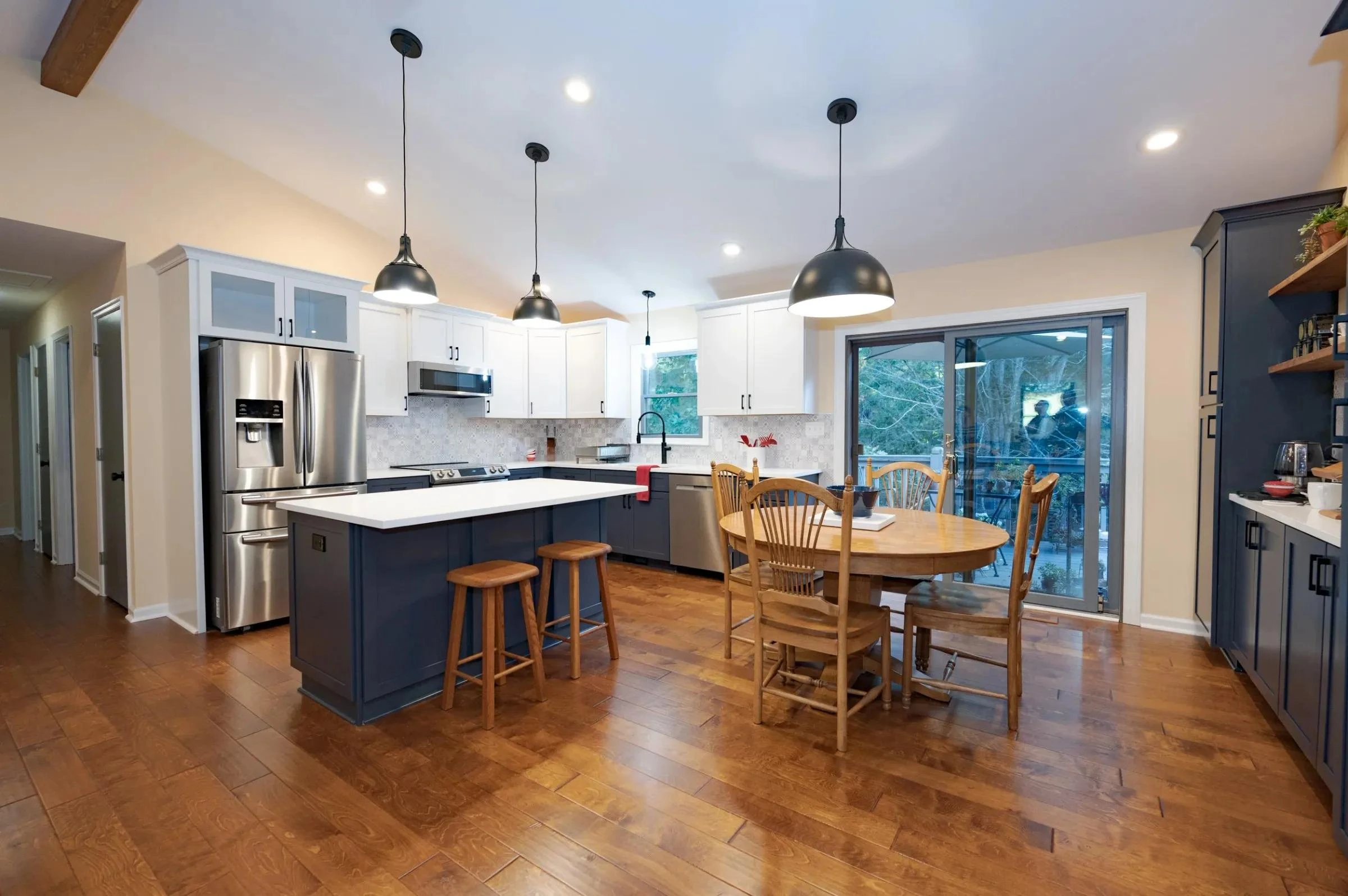 Kitchen with white cabinets and a wood island