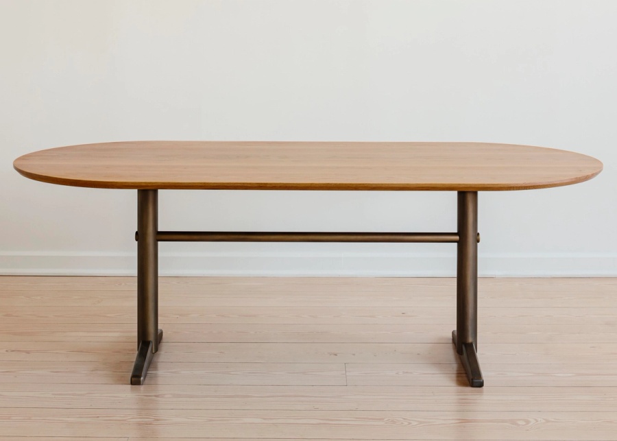 Pillar Dining Table with racetrack top and brass legs