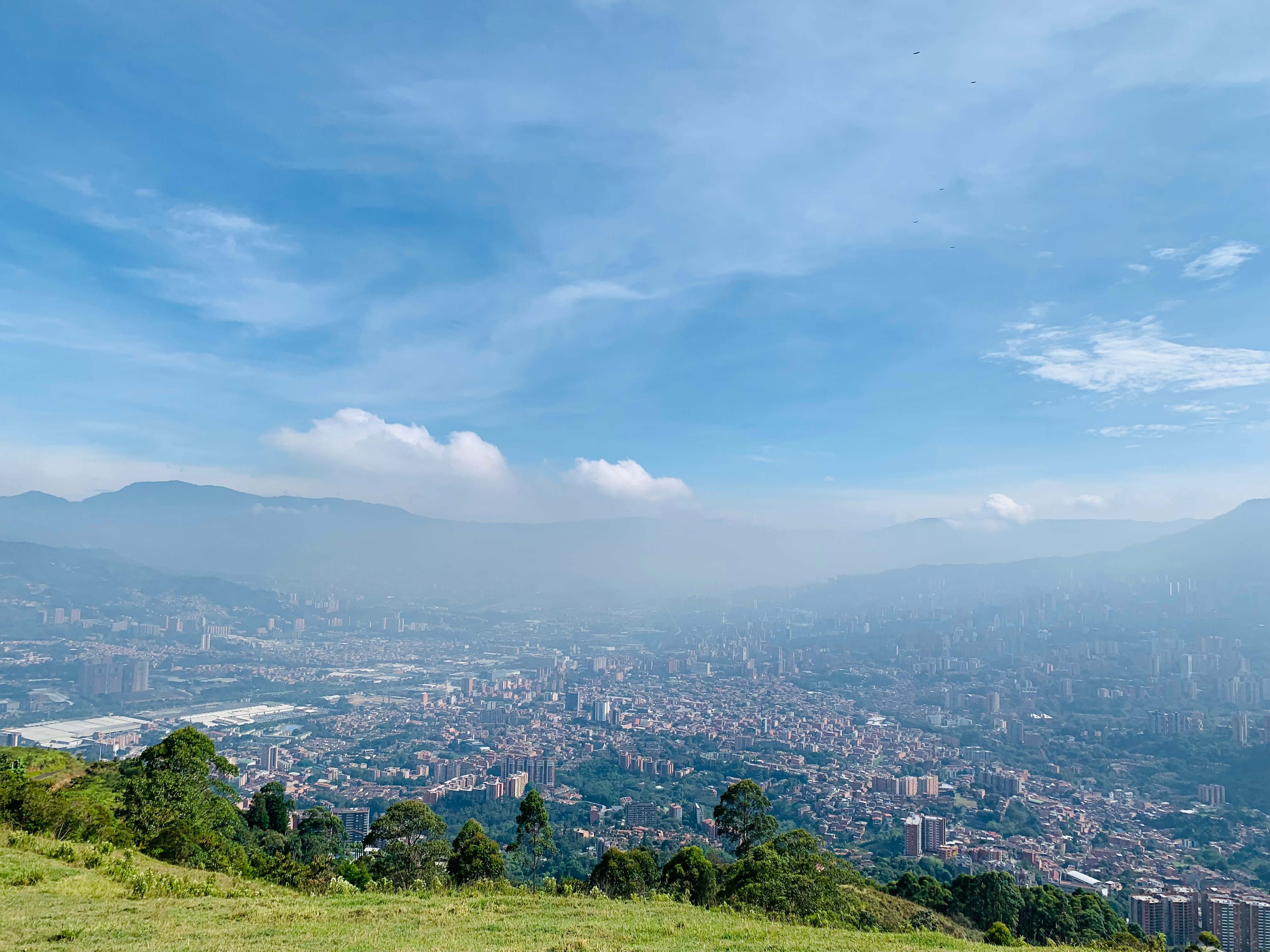 View from Mirador Sin Mi in Sabaneta overlooking the Medellín valley at sunset.