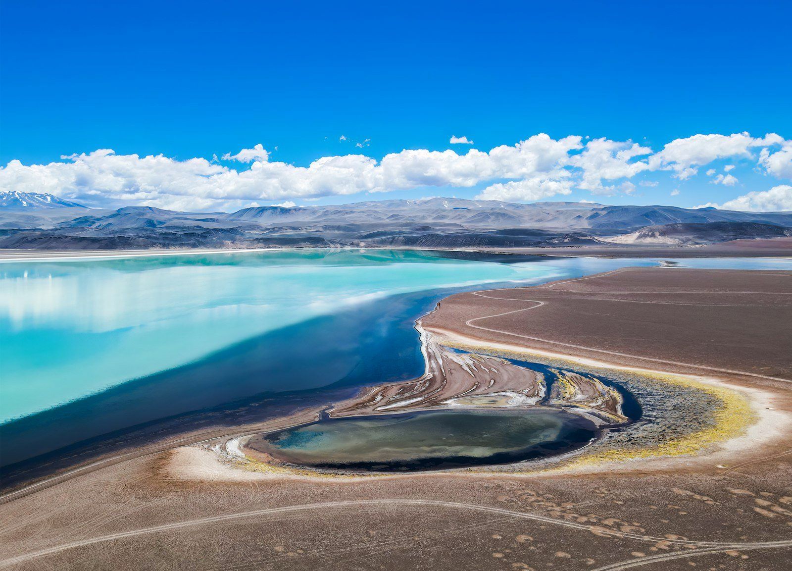 a large body of water surrounded by mountains