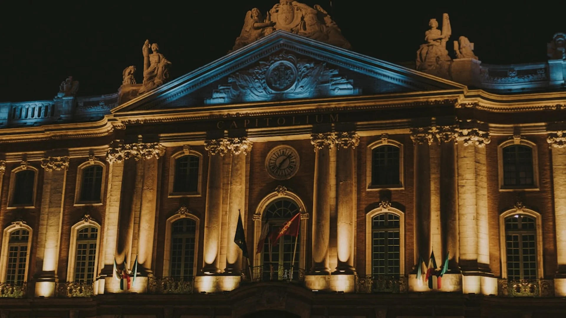 a large clock mounted to the side of a building