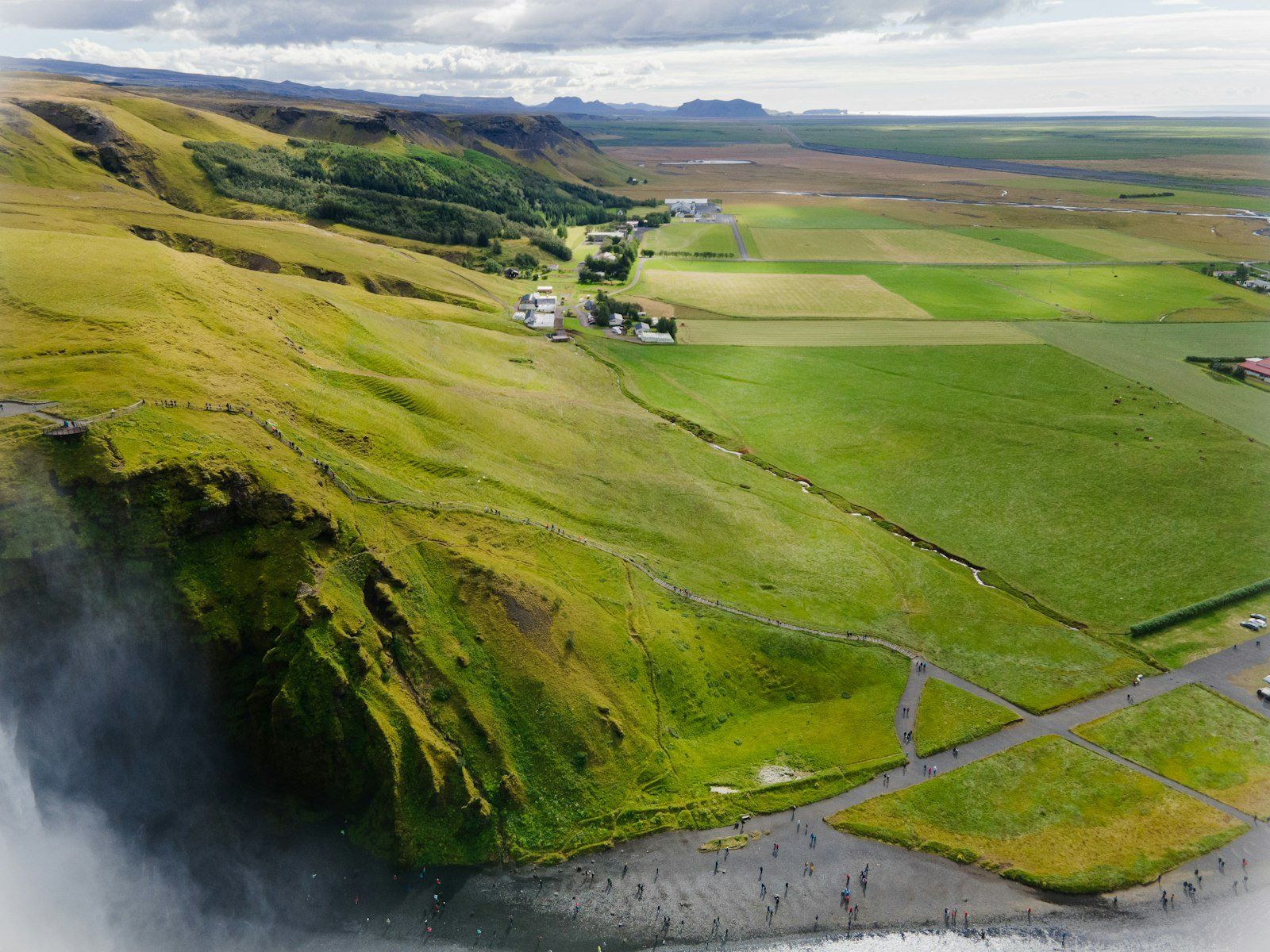 An aerial view of a valley with a river running through it