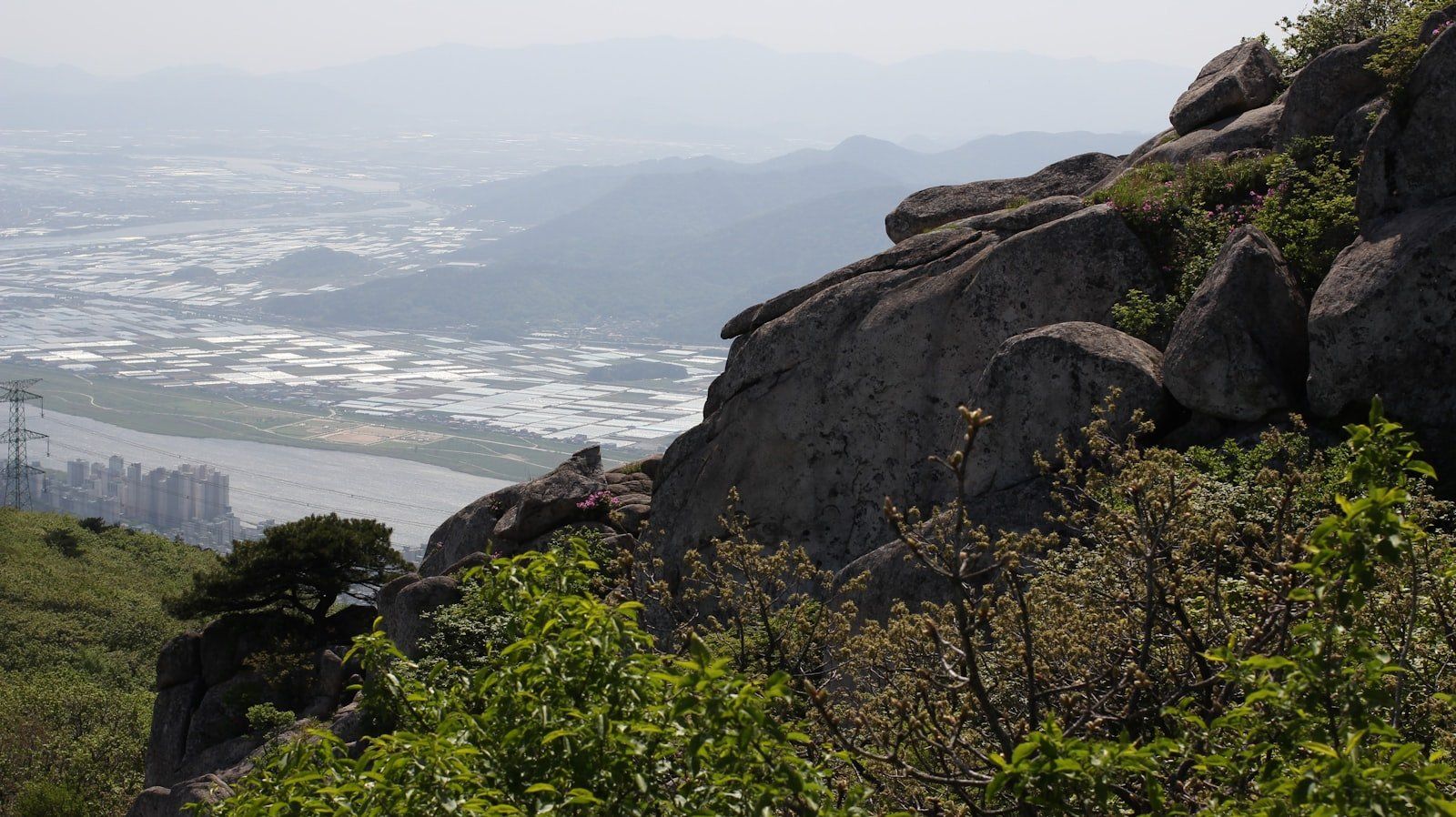 a view of a city from a mountain top