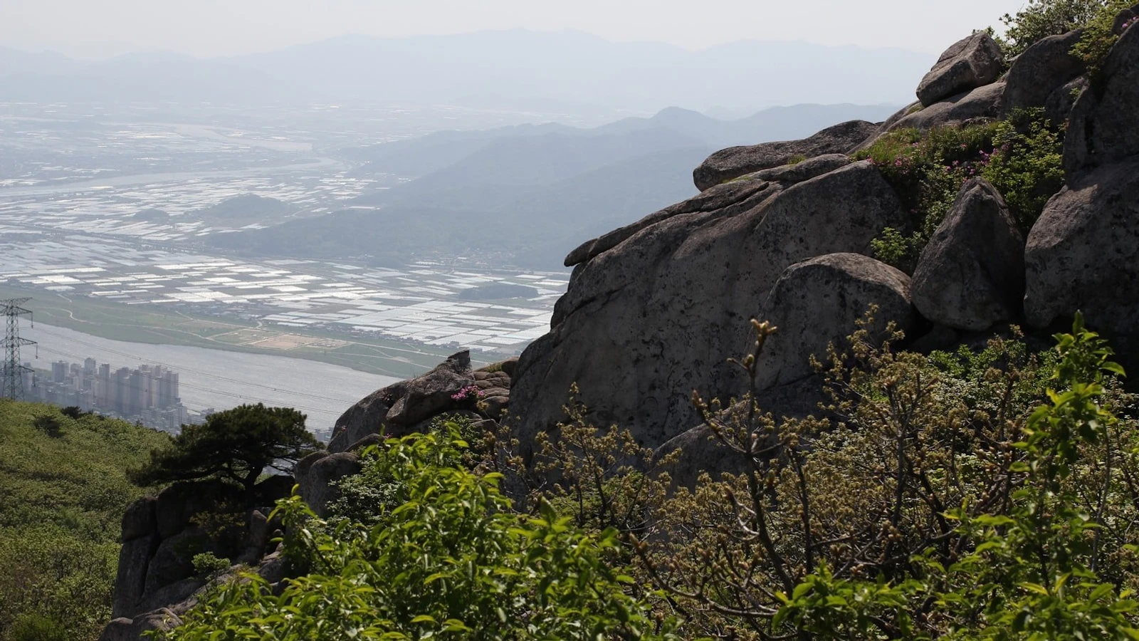 a view of a city from a mountain top
