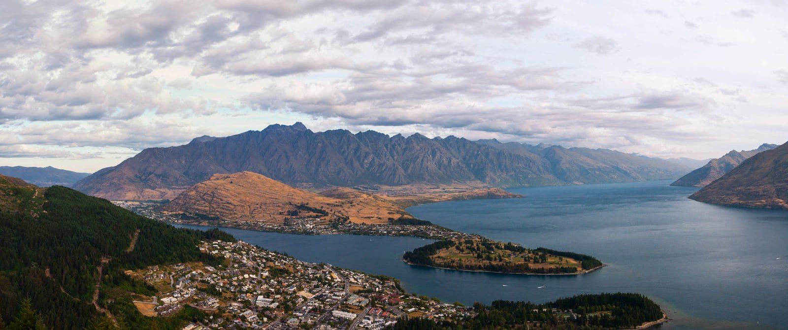 a scenic view of a lake and mountains