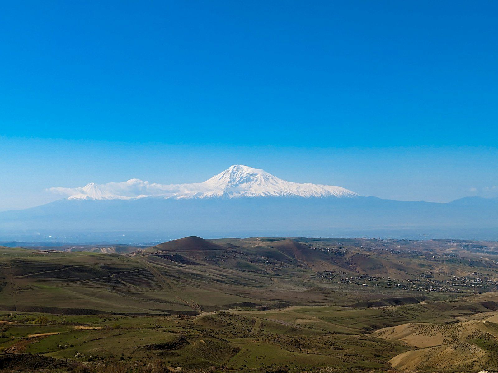 a view of a snowy mountain in the distance