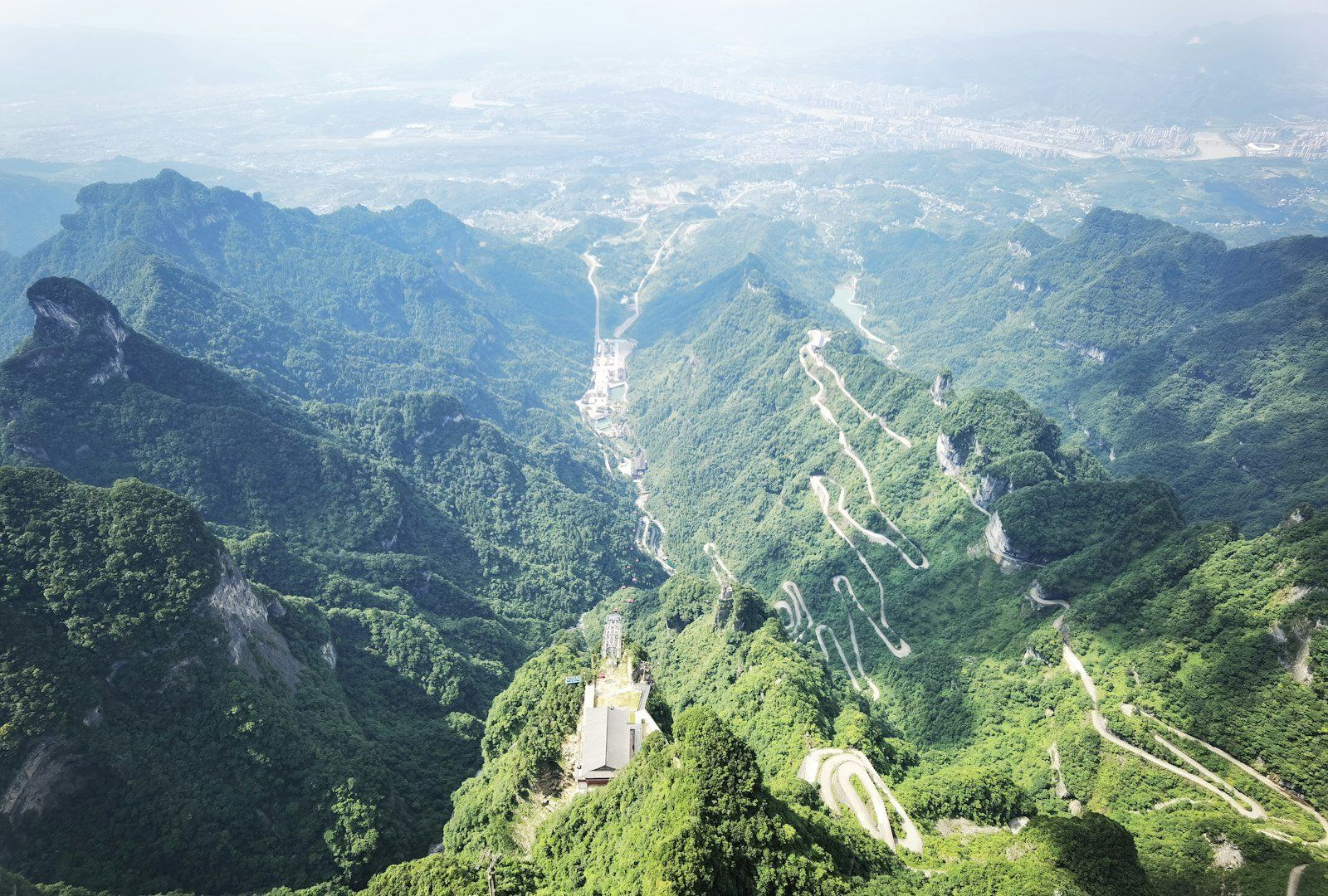 a scenic view of a mountain with a winding road