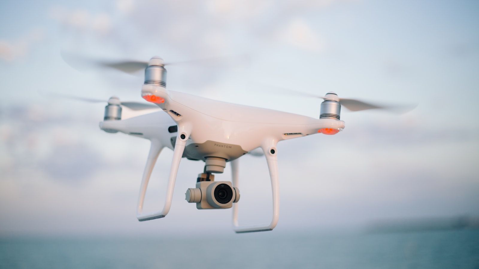 Drone filter kit with ND and polarizer filters laid out on a wooden surface