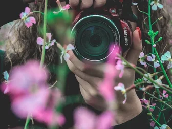 A vintage rangefinder camera on a wooden surface — the theme of this week: a camera industry going quieter, with a few brands shipping hard into the gap