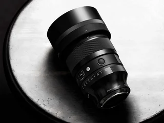 Sigma 85mm F1.2 DG Art lens official product photo on a dark background