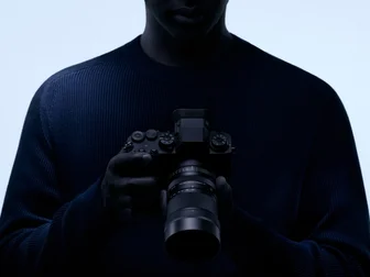 Sigma 50-120mm F2.8 DC OS Contemporary telephoto zoom lens on a black background, official Sigma product photo
