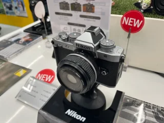 Nikon Zf silver and black mirrorless camera with retro dials