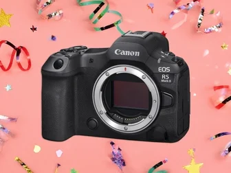Canon EOS R5 Mark II mirrorless camera body, front three-quarter view, with RF lens mount visible