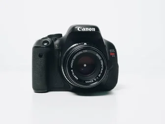 Canon EOS R1 mirrorless camera with new firmware 1.3.0 update, representing today's announcement