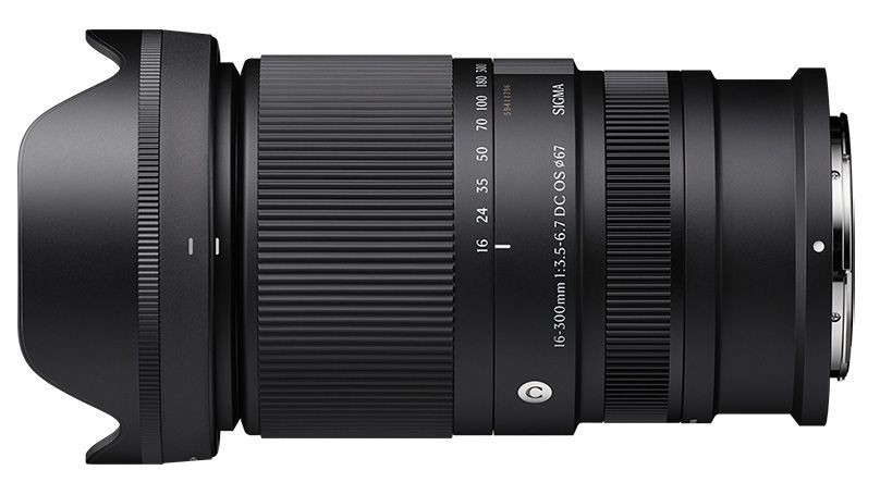 Sigma 16-300mm f/3.5-6.7 DC OS Contemporary for Nikon Z, official product photograph showing the lens with a 55mm filter thread on a textured stone surface.