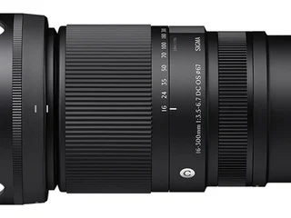 Sigma 16-300mm f/3.5-6.7 DC OS Contemporary for Nikon Z, official product photograph showing the lens with a 55mm filter thread on a textured stone surface.