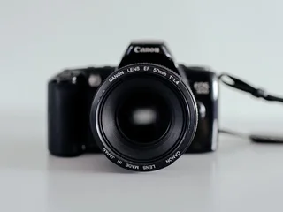 A vintage Canon EOS film camera with a 50mm f/1.4 lens photographed against a clean background, a still-life representative image for the Lightroom June 2026 update story
