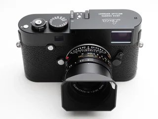 A 1970s Leica Summicron-M 35mm f/2 manual focus lens mounted on a Leica M-P body — the kind of vintage glass that inspired the manual-lens-on-mirrorless movement