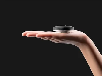 Viltrox 28mm f/4.5 pancake lens for L-mount cameras, showing the ultra-thin profile and 60g weight