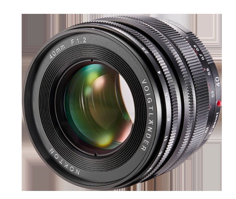 Voigtländer Nokton 40mm f/1.2 SE E-Mount lens shown lying on its side with focus and aperture markings visible.