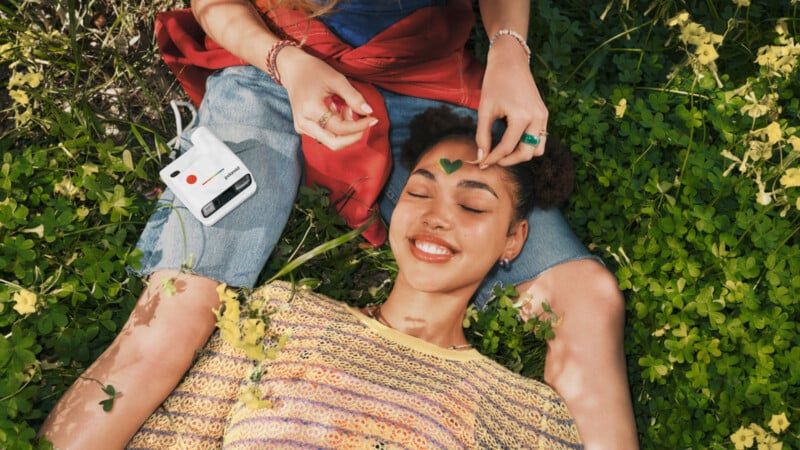 Polaroid Go Gen 3 lifestyle shot with friends at the beach