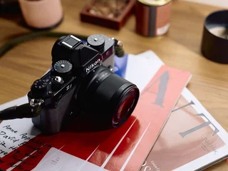 Viltrox AF 50mm F2 Air full-frame prime mounted on a Panasonic Lumix S1 II / S5 II body with the Lumix S 24-60mm F2.8 zoom in the background.