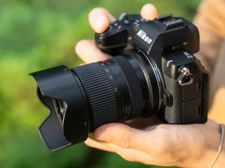 Tamron 16-50mm F2.8 A (Model B091) mounted on a Nikon APS-C body, official product photo