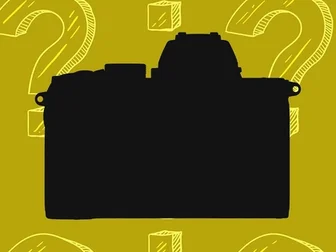 A hybrid camera silhouette on a yellow background patterned with question marks — the Nikon Z70 leak from Apple's ProRes page has the industry asking what this APS-C flagship will actually be