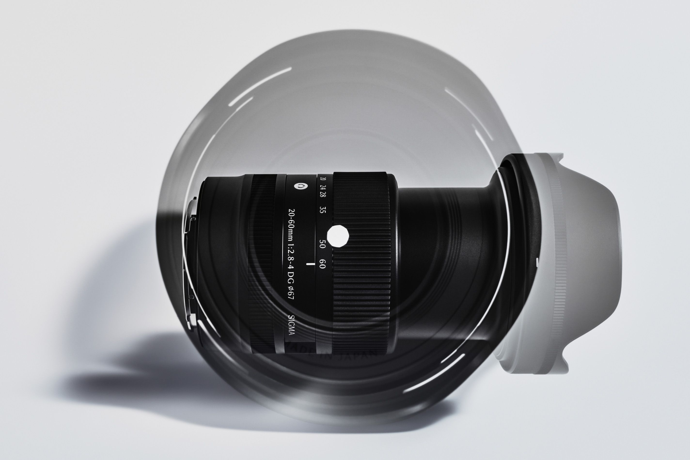 Sigma 20-60mm F2.8-4 DG Contemporary lens with hood, official product photo