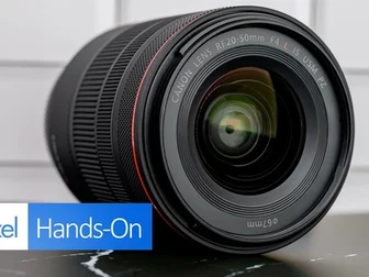 Canon RF 20-50mm f/4 L IS USM PZ lens shown upright on a dark surface with white tiled background
