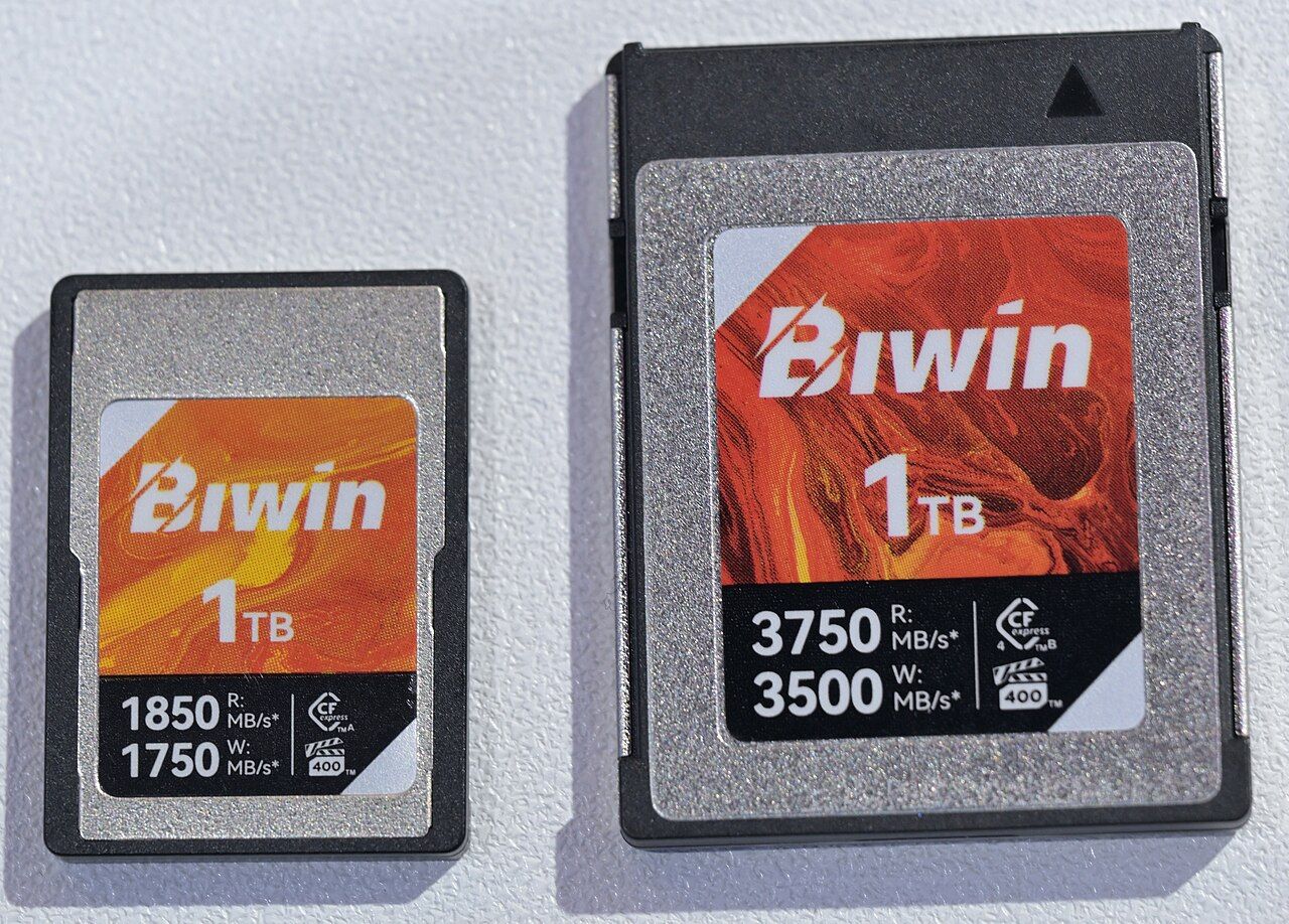 Two CFexpress cards (Type A smaller and Type B larger) photographed at Computex 2025 for size comparison
