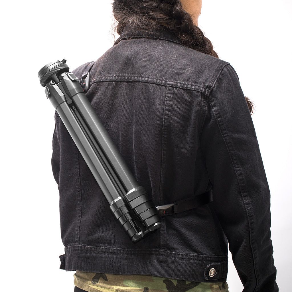 Carrying the Peak Design Travel Tripod with cross-body strap at an airport