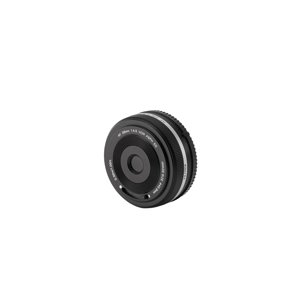 Viltrox 28mm f/4.5 pancake lens front detail showing the quick-release cap mechanism