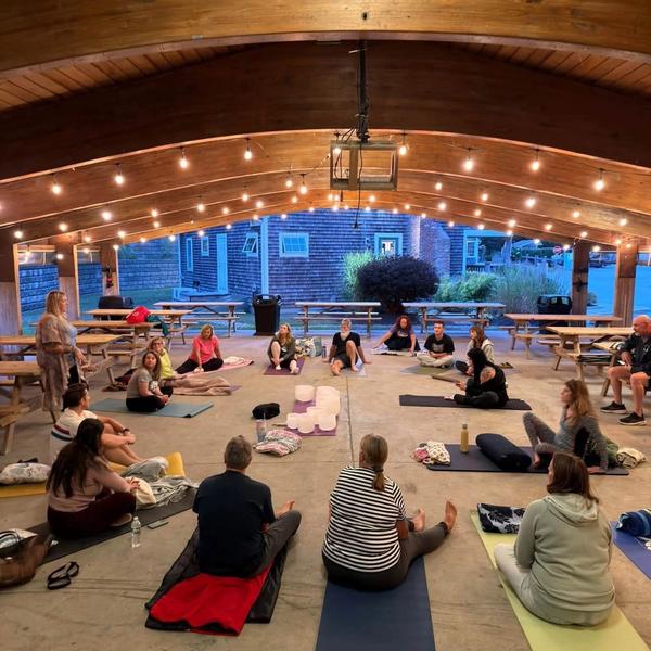 Sound healing event with people seated.