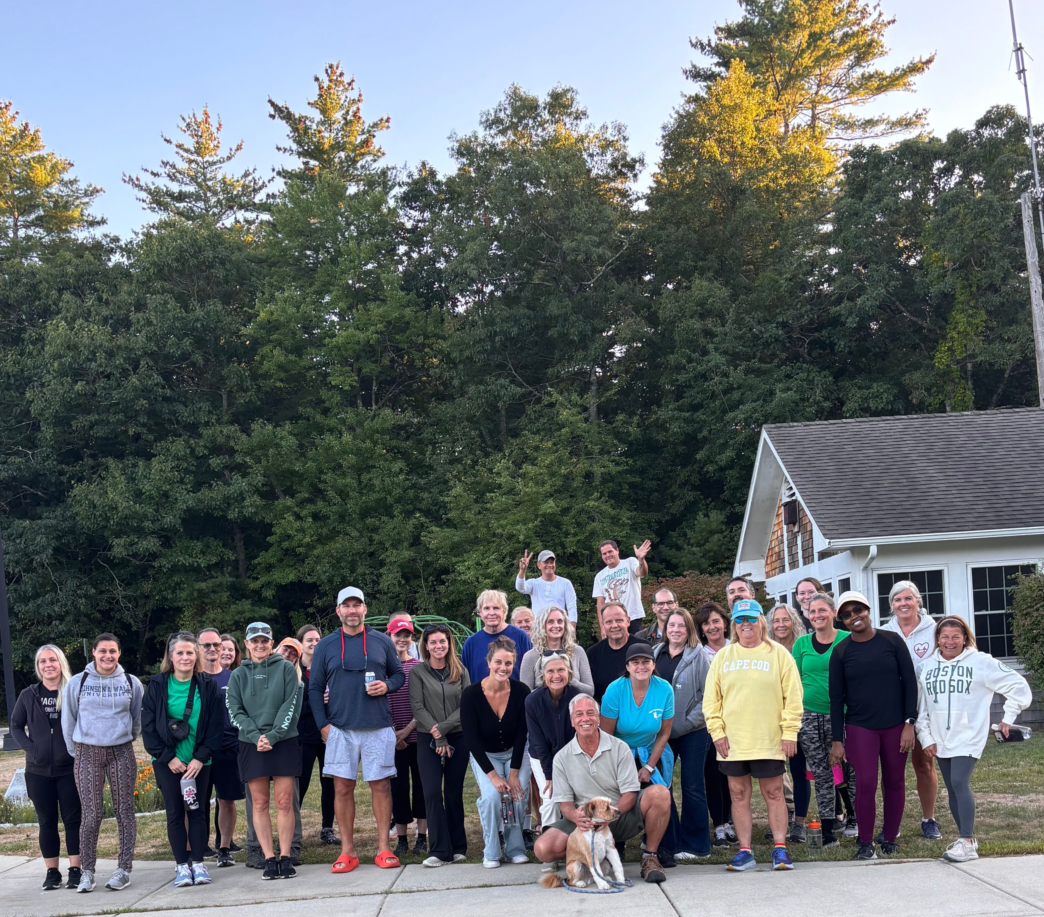 Group of people after a walk at sunset.