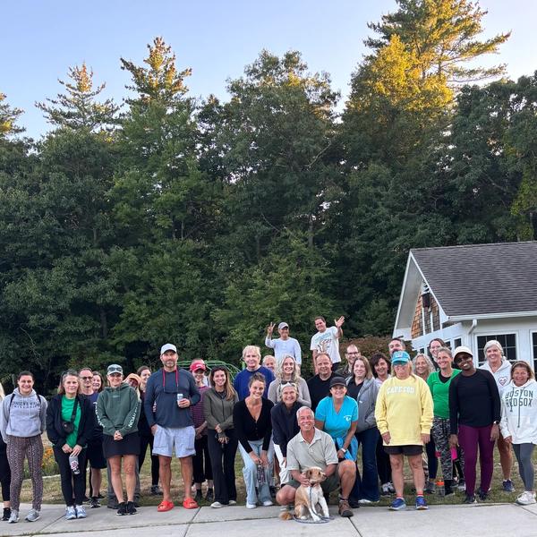 Group of people after a walk at sunset.