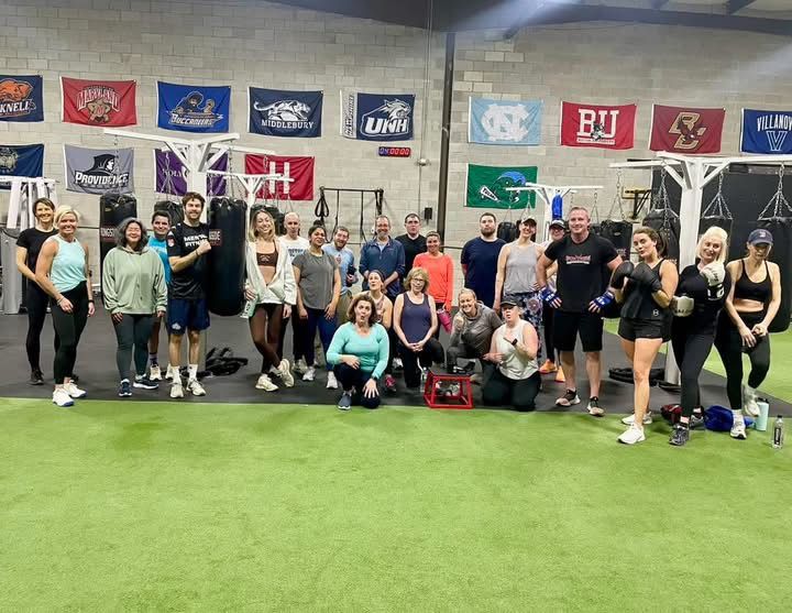 A group of people after boxing class. 