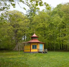 The Chinese Pavilion stands as a colourful eye-catcher at the end of the path through Liselund Park.