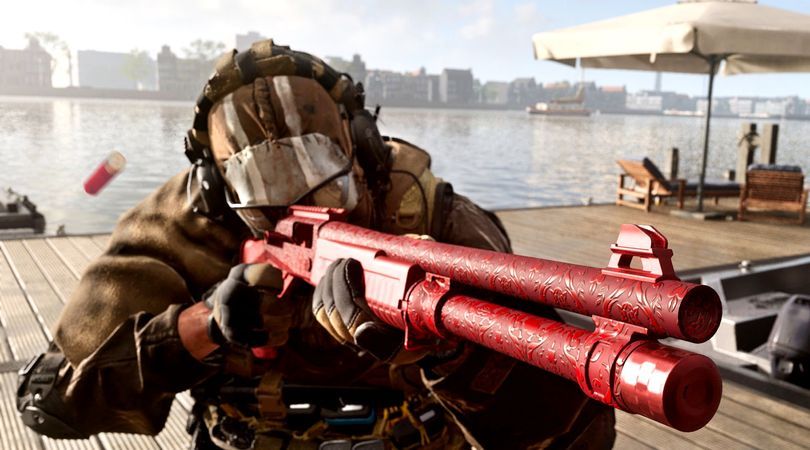 Warzone player aiming down sights of a shotgun equipped with a red camouflage