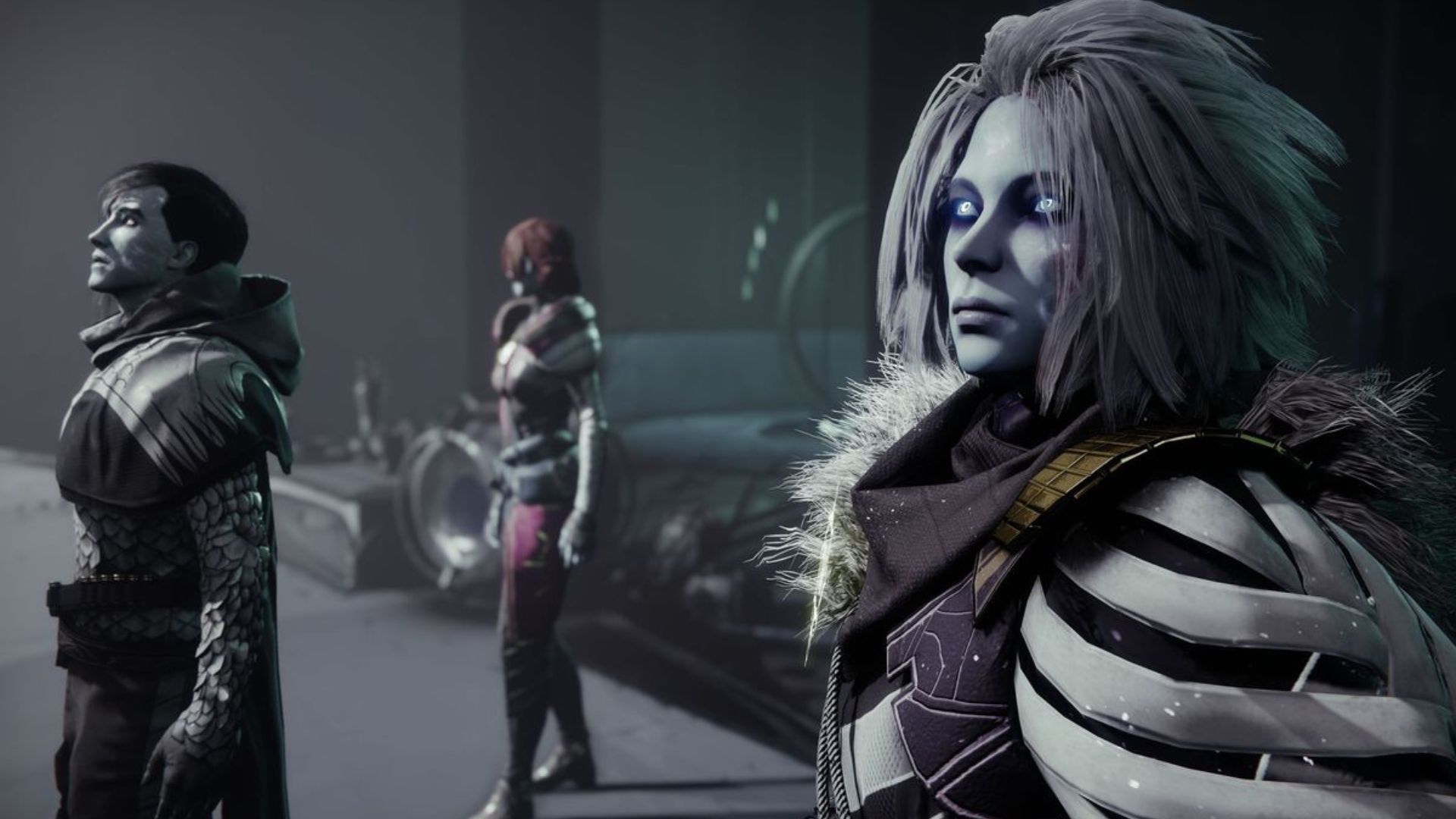 The Crow and Mara Sov are standing next to each other in a dark room looking at something off-screen